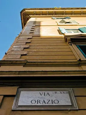 a tall building with a sign on the side of it at Le Stanze Di Orazio in Rome