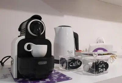 a coffee maker sitting on top of a counter at Domus Paradiso in Piazza Navona in Rome