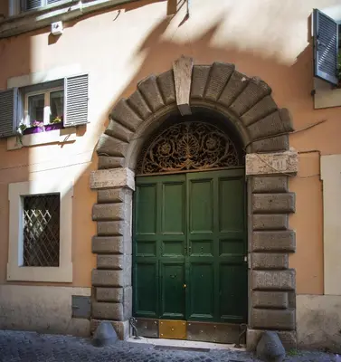 an entrance to a building with a green door at Domus Paradiso in Piazza Navona in Rome