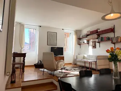 a living room with a couch and a table at Sunny Side Trastevere in Rome