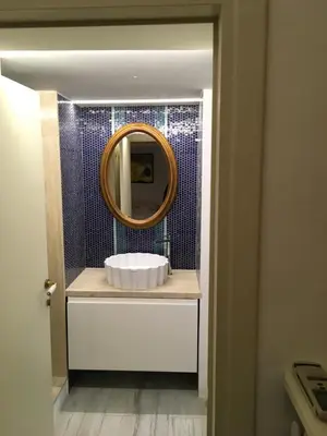 a bathroom with a white sink and a mirror at Sunny Side Trastevere in Rome