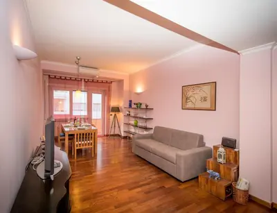 a living room with a couch and a table at Elettra Luxury Home in Rome