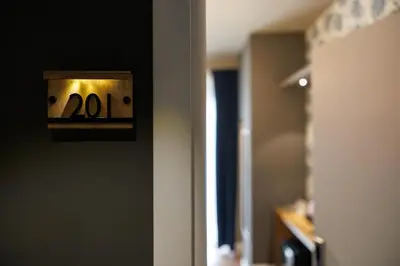 an open door with a clock on a wall at Il Corso Comfort Rooms in Rome