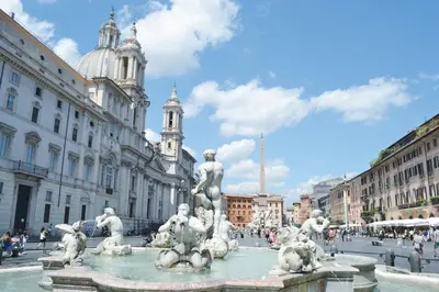 a fountain in the middle of a city with buildings at Da Adriana al vaticano in Rome