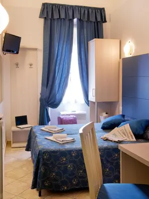 a room with two beds and a window at Albergo Marechiaro in Rome