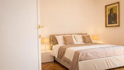 a bedroom with a large bed in a room at Rental in Rome Colosseo View Luxury in Rome