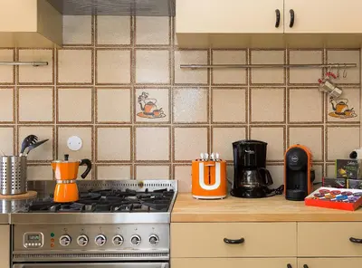 a kitchen with a stove and a counter top at Dome Terrace Apartment in Rome