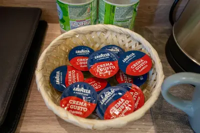 a basket filled with red white and blue tooth paste at Rome Love Hotel in Rome
