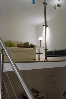 a living room with a couch and a table at Suite Manzoni in Rome