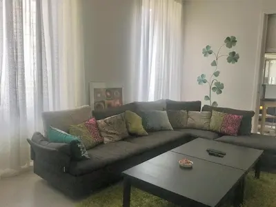 a living room with a couch and a coffee table at Suite Manzoni in Rome
