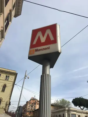 a mazon sign on top of a pole at Suite Manzoni in Rome