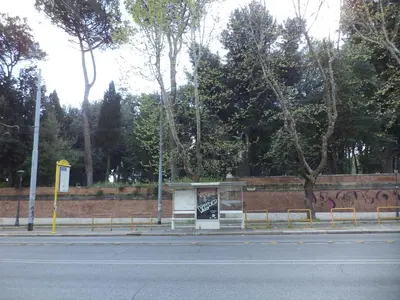 a bus stop with benches on the side of a street at B&B CultRoma Roof Garden in Rome