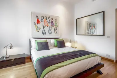 a bedroom with a large bed in a room at HT N°9 Colosseo in Rome