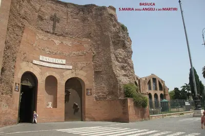 an old brick building with a cross on top of it at Roma Vespahouse in Rome