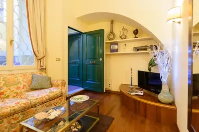 a living room with a couch and a table at Apartment Margutta Center in Rome