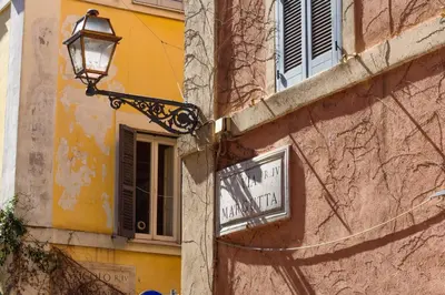 a street light on the side of a building at Apartment Margutta Center in Rome