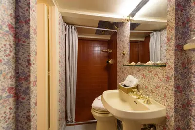 a bathroom with a sink and a toilet and a mirror at Apartment Margutta Center in Rome
