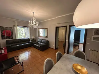 a living room with a couch and a table at Family`s Apartment Trastevere in Rome