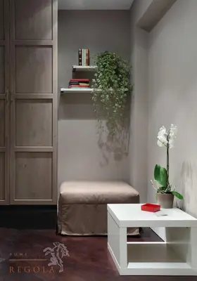 a living room with a bench and a table at Residence Regola in Rome