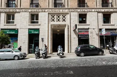 a group of scooters parked in front of a building at Prestigious Apartment via Barberini in Rome