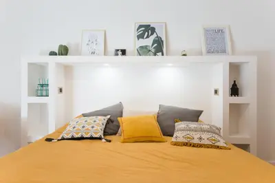a bed with two pillows on top of it at Be Rome in Rome