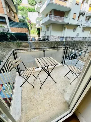 two chairs and a table on a balcony at Be Rome in Rome