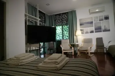 a hotel room with a bed with towels on it at Casa Mia Guesthouse in Rome