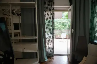a room with a sliding glass door to a patio at Casa Mia Guesthouse in Rome