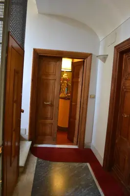 an empty hallway with two doors and a room at Hotel Al SanPietrino in Rome
