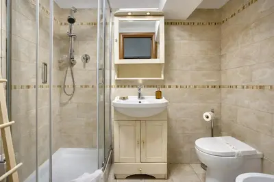 a bathroom with a toilet and a sink and a shower at Urbana 37 Maison - Rione Monti by RHR in Rome