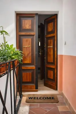 a welcome mat in front of a door at Urbana 37 Maison - Rione Monti by RHR in Rome