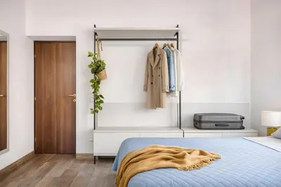 a bedroom with a bed and a closet at Urbana 37 Maison - Rione Monti by RHR in Rome