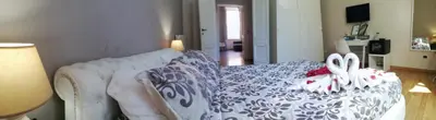 a room with a bed with two rabbits on it at Residenza a San Pietro in Rome
