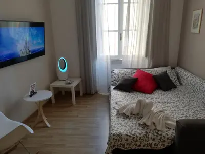 a bedroom with a bed and a tv on the wall at Residenza a San Pietro in Rome