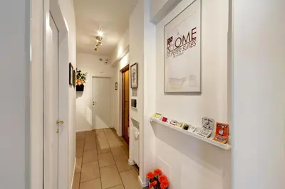 a hallway with white walls and a white hallway with a hallway at Pianeta Roma 62 in Rome