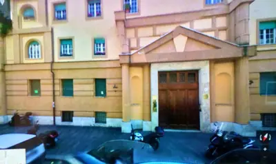 a group of motorcycles parked in front of a building at Arches B&B in Rome