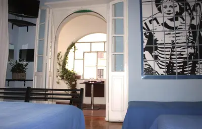 a room with an archway and a window and a bed at Arches B&B in Rome
