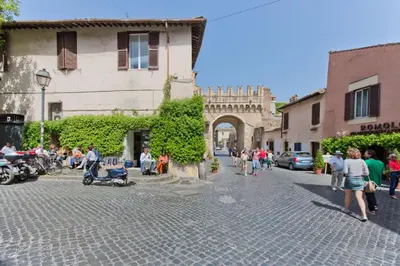 a group of people walking around a street in a city at Il Leopardo (Trastevere) in Rome