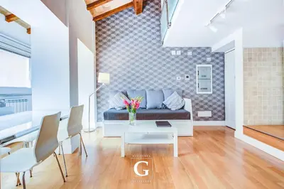 a living room with a couch and a table at Residenza Gonfalone in Rome