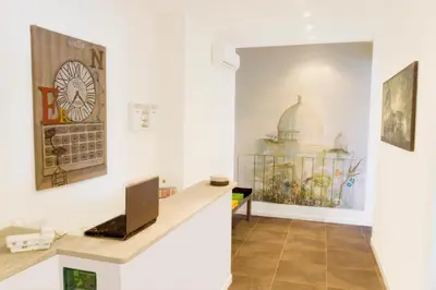 an office with a desk and a laptop on a counter at Le Cupole in Rome