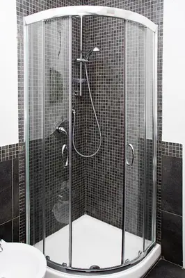 a shower with a glass enclosure in a bathroom at Le Cupole in Rome