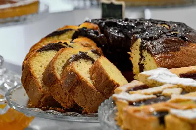 a bundt cake on a glass plate on a table at Il Fascino Di Roma in Rome