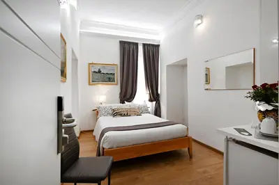 a hotel room with a bed and a window at Il Fascino Di Roma in Rome
