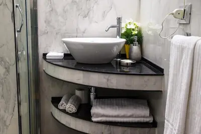 a bathroom with a sink and towels on a counter at Il Fascino Di Roma in Rome