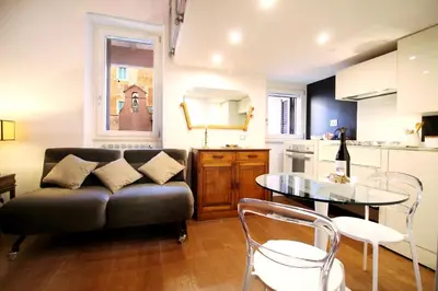 a living room with a couch and a table at Charm & Design in Gourmet District in Rome