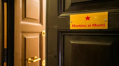 a sign on a door that says marina at month at Hotel Martino Ai Monti in Rome