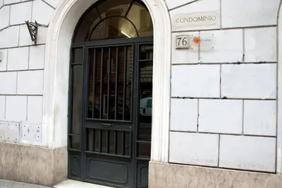 an entrance to a building with a black door at Meltin' Rome Guest House in Rome
