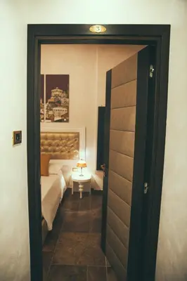 a door leading into a bedroom with a bed at Lighthouse Suites Trastevere in Rome
