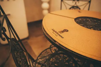 a surfboard sitting on top of a chair at Lighthouse Suites Trastevere in Rome