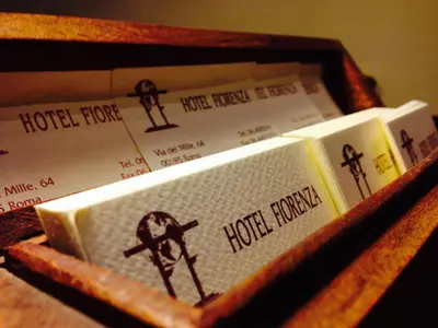 a wooden box filled with books with a cross on them at Hotel Fiorenza in Rome